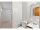 Cozy bathroom with a neutral sink, cabinet, and toilet at 1637 S Stuart St, Denver, CO 80219