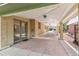 Spacious covered patio with brick columns and access to the home's interior at 1637 S Stuart St, Denver, CO 80219