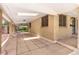 Large covered patio featuring brick columns and tiled flooring at 1637 S Stuart St, Denver, CO 80219