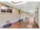 Tiled sunroom with access to the backyard, featuring a skylight and ample natural light at 1637 S Stuart St, Denver, CO 80219