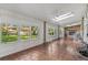 Bright sunroom with tile floors, skylights, a fireplace, and large windows at 1637 S Stuart St, Denver, CO 80219