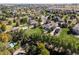 High-angle aerial view of the residential area with lush landscaping, showcasing the property's location at 6449 E 163Rd Ave, Brighton, CO 80602