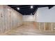 Clean unfinished basement with light wood and wainscotting at 6449 E 163Rd Ave, Brighton, CO 80602