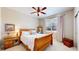 Cozy bedroom with wood furniture, a large window, and neutral tones for a warm, inviting feel at 6449 E 163Rd Ave, Brighton, CO 80602