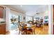 Cozy dining area with a sliding glass door, hardwood floors, and a view of the backyard at 6449 E 163Rd Ave, Brighton, CO 80602