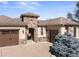 Beautiful stone accents highlight this charming home, complemented by a well-manicured lawn at 6449 E 163Rd Ave, Brighton, CO 80602