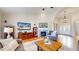 Bright and airy living room with hardwood floors, fireplace, and a welcoming open layout at 6449 E 163Rd Ave, Brighton, CO 80602