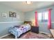 Cozy bedroom with a plush rug, light blue walls, and natural light at 2175 E 126Th Way, Thornton, CO 80241