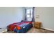 This bedroom features natural light from a window, complemented by a playful Spiderman-themed bedspread at 2175 E 126Th Way, Thornton, CO 80241
