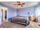 Serene bedroom with a ceiling fan, neutral carpet, and a large window providing natural light at 2175 E 126Th Way, Thornton, CO 80241
