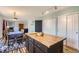 Open kitchen with an island that connects to the dining area and living room at 2175 E 126Th Way, Thornton, CO 80241
