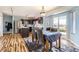 Well-lit kitchen featuring stainless steel appliances, dark cabinets, and a breakfast nook with outdoor access at 2175 E 126Th Way, Thornton, CO 80241