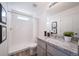 Bright bathroom with a tiled shower, stylish vanity, and modern fixtures at 13625 E 103Rd Pl, Commerce City, CO 80022