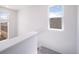Bright staircase landing with large windows for lots of natural light at 13625 E 103Rd Pl, Commerce City, CO 80022