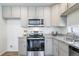 Updated kitchen with stainless steel appliances and granite countertops at 13625 E 103Rd Pl, Commerce City, CO 80022