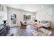Bright and airy living room featuring stylish furnishings and a view of the neighborhood at 13625 E 103Rd Pl, Commerce City, CO 80022