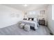 The main bedroom featuring a gray color scheme, lots of natural light and stylish decor at 13625 E 103Rd Pl, Commerce City, CO 80022