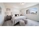 Main bedroom featuring a gray color scheme, lots of natural light and stylish decor at 13625 E 103Rd Pl, Commerce City, CO 80022