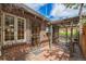 Backyard brick patio attached to a brick home with a covered pergola at 1900 Magnolia St, Denver, CO 80220