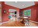 Cozy dining room with natural light, hardwood floors, and comfortable seating, connecting to the living area at 1900 Magnolia St, Denver, CO 80220