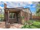 Charming brick home featuring a covered porch and well-maintained landscaping, creating a welcoming curb appeal at 1900 Magnolia St, Denver, CO 80220