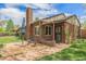 Charming brick home with a brick patio, perfect for outdoor entertaining and enjoying the beautiful surroundings at 1900 Magnolia St, Denver, CO 80220