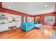 Stylish living room featuring built-in bookshelves, hardwood floors, and comfortable seating for modern living at 1900 Magnolia St, Denver, CO 80220