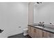 Simple bathroom with floating vanity and modern fixtures at 8077 Raphael Ln, Littleton, CO 80125