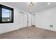 Spacious bedroom featuring a double door closet and a window with hillside view at 8077 Raphael Ln, Littleton, CO 80125