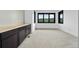 Spacious bedroom with built-in cabinetry and view at 8077 Raphael Ln, Littleton, CO 80125