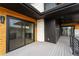 Modern deck with composite decking, glass doors and mountain views at 8077 Raphael Ln, Littleton, CO 80125