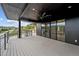 Covered deck with composite decking, ceiling fan and mountain views at 8077 Raphael Ln, Littleton, CO 80125