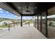 Spacious deck offering mountain and neighborhood views with a ceiling fan at 8077 Raphael Ln, Littleton, CO 80125