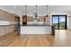 Gourmet kitchen with expansive island and high-end appliances at 8077 Raphael Ln, Littleton, CO 80125
