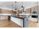 Modern kitchen with large island and stainless steel appliances at 8077 Raphael Ln, Littleton, CO 80125