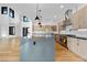 Modern kitchen with a large island and stainless steel appliances at 8077 Raphael Ln, Littleton, CO 80125