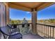 Charming balcony view overlooking lush landscaping with seating to enjoy the outdoors at 17497 Nature Walk Trl # 302, Parker, CO 80134