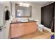 Well-lit bathroom featuring vanity with storage and modern fixtures at 17497 Nature Walk Trl # 302, Parker, CO 80134