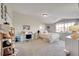 Bright bedroom featuring a bed, desk area, closet, and window for natural light at 17497 Nature Walk Trl # 302, Parker, CO 80134