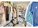 Spacious walk-in closet offering ample storage with clothing racks and shelving units at 17497 Nature Walk Trl # 302, Parker, CO 80134