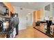 Well-equipped kitchen features black appliances, granite countertops, and ample cabinet space at 17497 Nature Walk Trl # 302, Parker, CO 80134