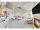 Inviting living area featuring vaulted ceilings, a fireplace, and access to the outdoors at 17497 Nature Walk Trl # 302, Parker, CO 80134