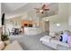 Spacious open-concept living area with kitchen, dining, and living spaces under a vaulted ceiling at 17497 Nature Walk Trl # 302, Parker, CO 80134