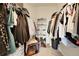 Spacious walk-in closet with ample storage and shoe racks for organized living at 17497 Nature Walk Trl # 302, Parker, CO 80134