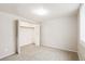 Bedroom with a neutral colored carpet and closet with bi-fold doors at 6371 Iris Ct, Arvada, CO 80004