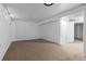Spacious unfinished basement with carpeting, ready for customization and ample storage at 12054 E 3Rd Ave, Aurora, CO 80011