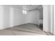 Unfinished basement featuring painted walls and floors, with plumbing for future improvements at 12054 E 3Rd Ave, Aurora, CO 80011