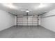 A spacious two car garage with white walls and an automatic door opener at 12054 E 3Rd Ave, Aurora, CO 80011