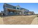 Large backyard space with covered patios offering lots of room for activities at 9081 Telluride Ct, Commerce City, CO 80022