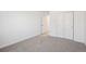 Bedroom with neutral carpet features an open closet and window at 9081 Telluride Ct, Commerce City, CO 80022